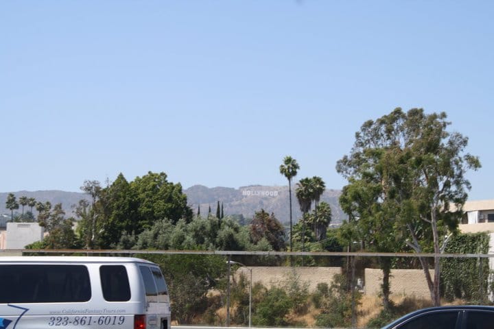 IN the far distance on top of the hill is the famous Hollywood Sign.